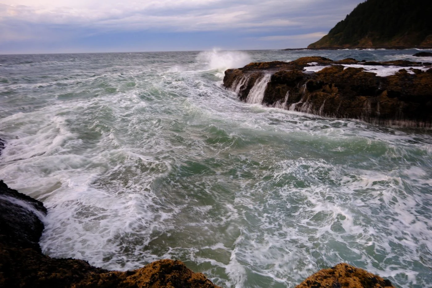 Large waves crashing against the Oregon coast