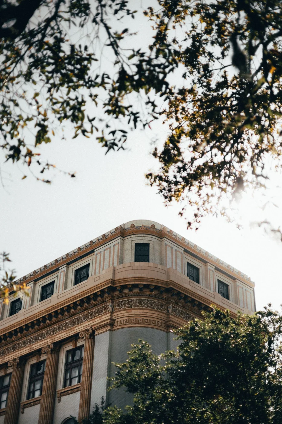 Historic architecture framed by trees in Savannah Georgia