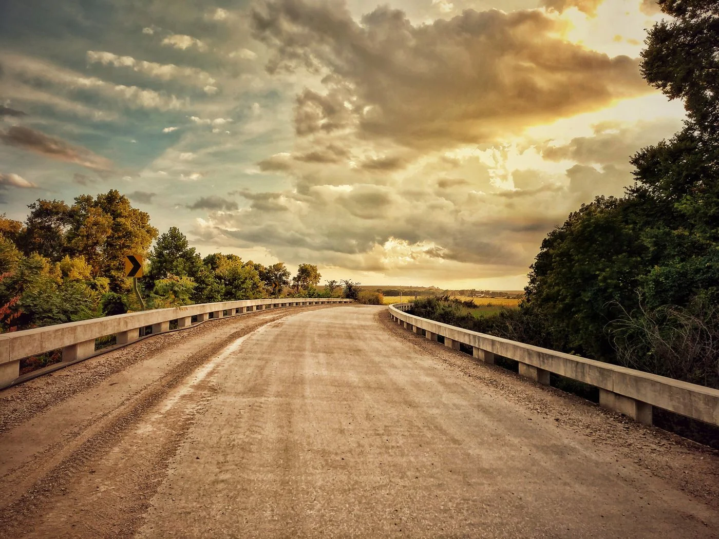 An open road curving through the Kansas landscape